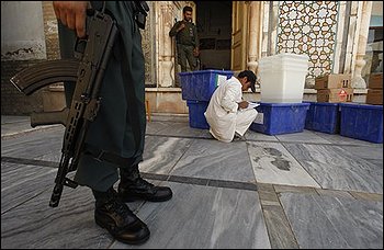 An election worker tallies polling materials at the Friday Mosque in Herat, Afghanistan, Wednesday, Aug. 19, 2009. Afghans will head to the polls on Aug. 20 to elect the new president. (AP Photo/Saurabh Das)